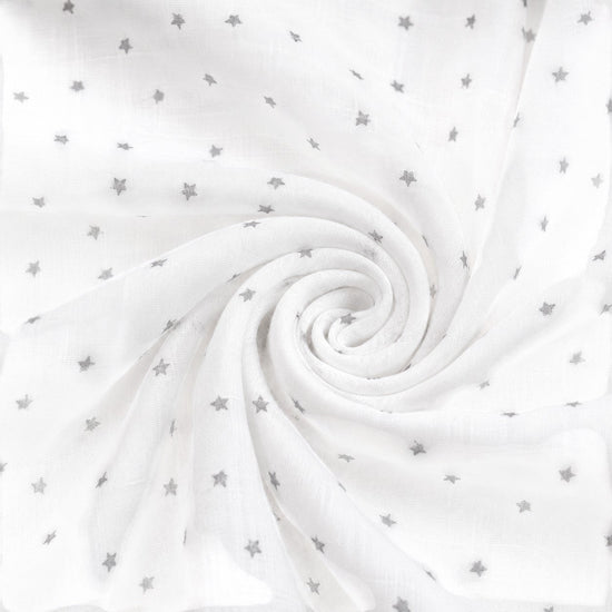 Carriage Boutique white muslin sleep gown fabric with a soft grey star print in a swirling pattern
