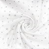 Carriage Boutique white muslin sleep gown fabric with a soft grey star print in a swirling pattern