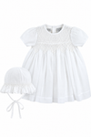 Carriage Boutique white voile christening dress with smocked bodice and matching bonnet for baby girls