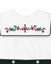 Carriage Boutique white cotton bobbie suit featuring a smocked bib with embroidered wooden soldier and holiday decor