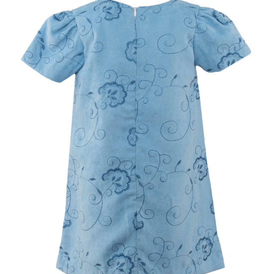 Back view of a Carriage Boutique toddler girl dress in light blue suede polyester with floral and dot patterns.